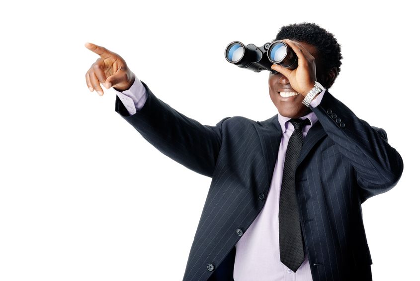 12753112 – binocular businessman pointing and smiling isolated on white alternate text for this image