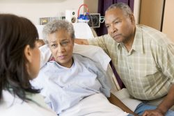 3724764 – doctor talking to senior couple alternate text for this image