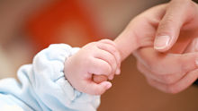 Newborn and parent alternate text for this image