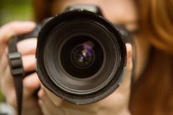 35883070 – close up of female photographer at the park alternate text for this image