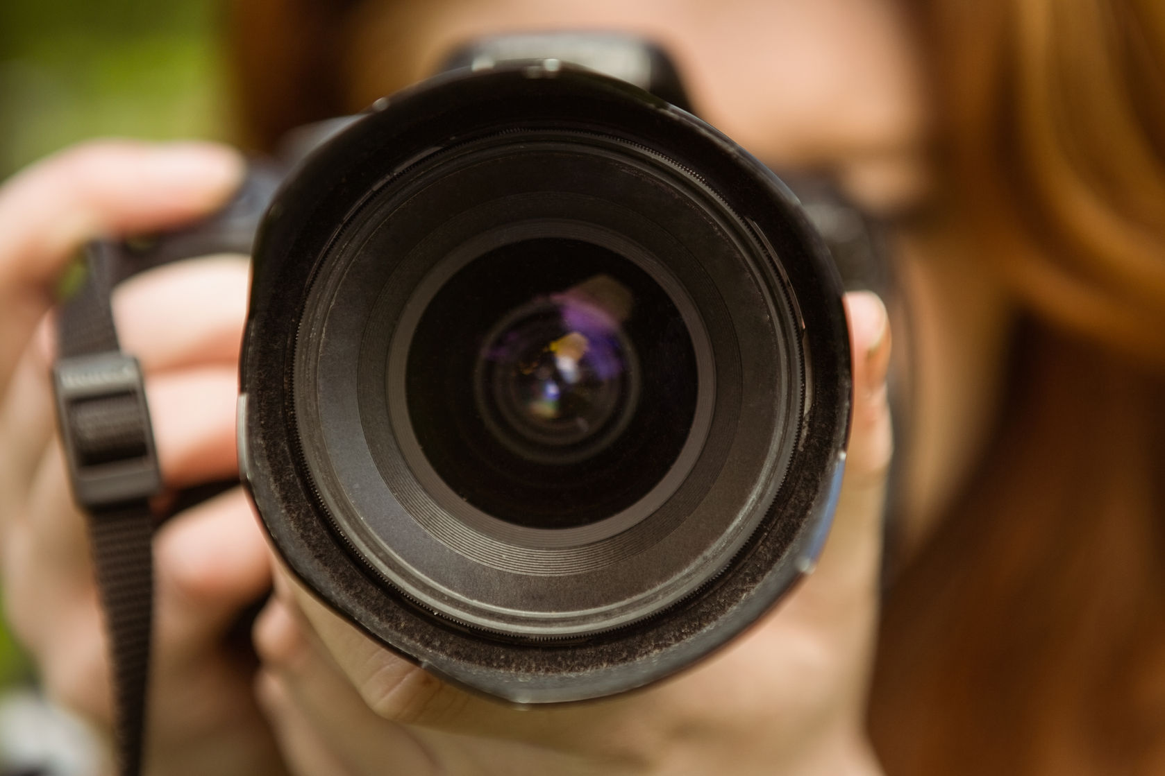 35883070 – close up of female photographer at the park alternate text for this image