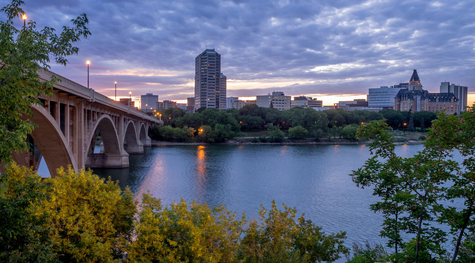 62441869 – saskatoon skyline at night along the saskatchewan river. alternate text for this image