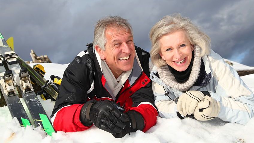 8401887 – senior couple having fun at ski resort alternate text for this image