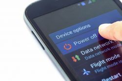 36797514 – close up finger press power off button on smartphone alternate text for this image