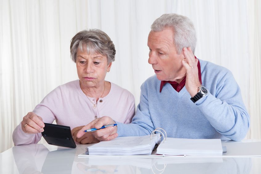 18497183 – stressed senior couple calculating budget at home alternate text for this image
