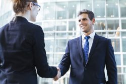 36301526 – business people shaking hands alternate text for this image