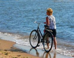 Women with bicycle alternate text for this image