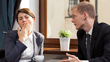 Yawning business woman alternate text for this image