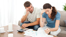 Young couple Calculator alternate text for this image