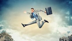 20327316 – image of young businessman jumping over gap alternate text for this image