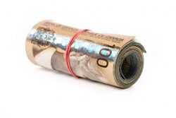 1093062 – a roll of canadian dollars with white background alternate text for this image