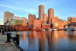 32980993 – boston skyline with financial district and boston harbor at sunrise alternate text for this image