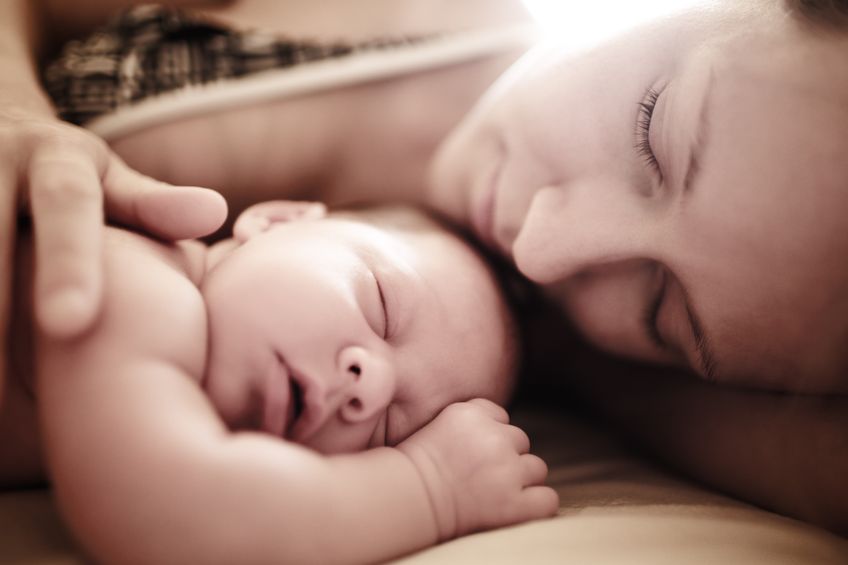 7622231 – newborn baby sleeping with mother. shallow dof. alternate text for this image