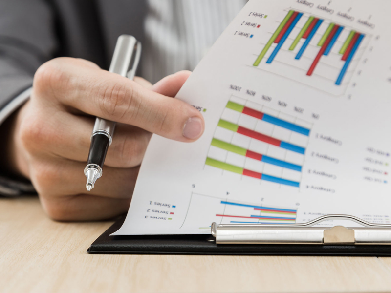 portfolio-800x600_Businessman-hand-showing-financial-report-on-table_25405182 alternate text for this image