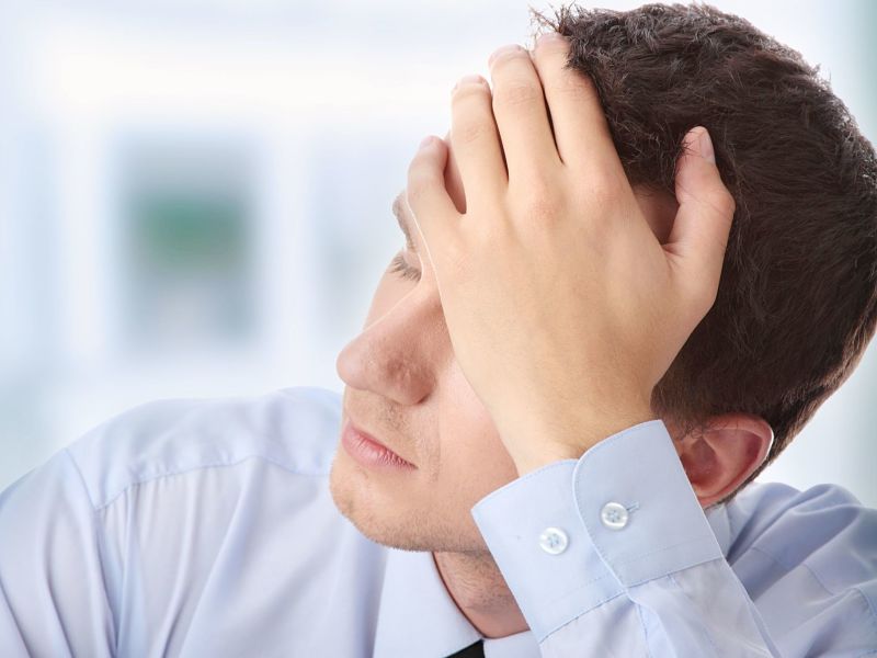 7821098 – businessman in depression with hand on forehead alternate text for this image