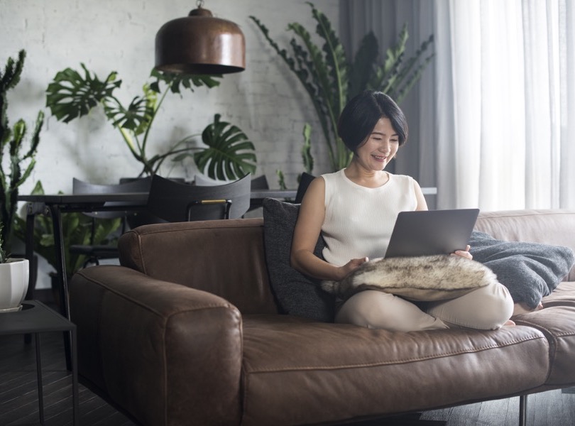 Young Asian woman working at home. alternate text for this image