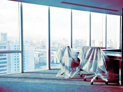 empty office chairs covered in bubble wrap