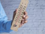 Hand holding Temperature measurement tools with copy space stock photo