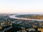 Aerial view of Shanghai skyline. Top view of deep water port with cargo ship and containers in Shanghai.