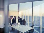 Adult senior diverse multi-ethnic Caucasian Hispanic Middle Eastern CEO executive team business people together in conference meeting room in contemporary modern office bright sunny daylight sunset dusk talking discussing planning organizing strategy well dressed suit and tie teamwork cooperation diversity multi-ethnic problems solutions unity cityscape downtown urban new beginnings breaking new ground dreamlike decisions choices the way forward diversity