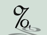 Businessman in front of giant percentage sign