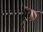 Hands behind bars
