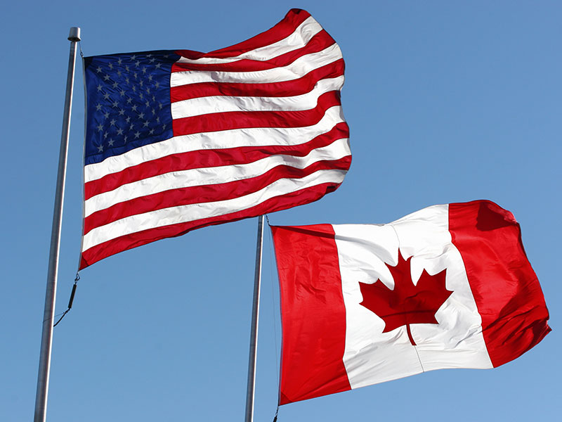 800×600-US-and-Canadian-flags-istock-KKIDD alternate text for this image
